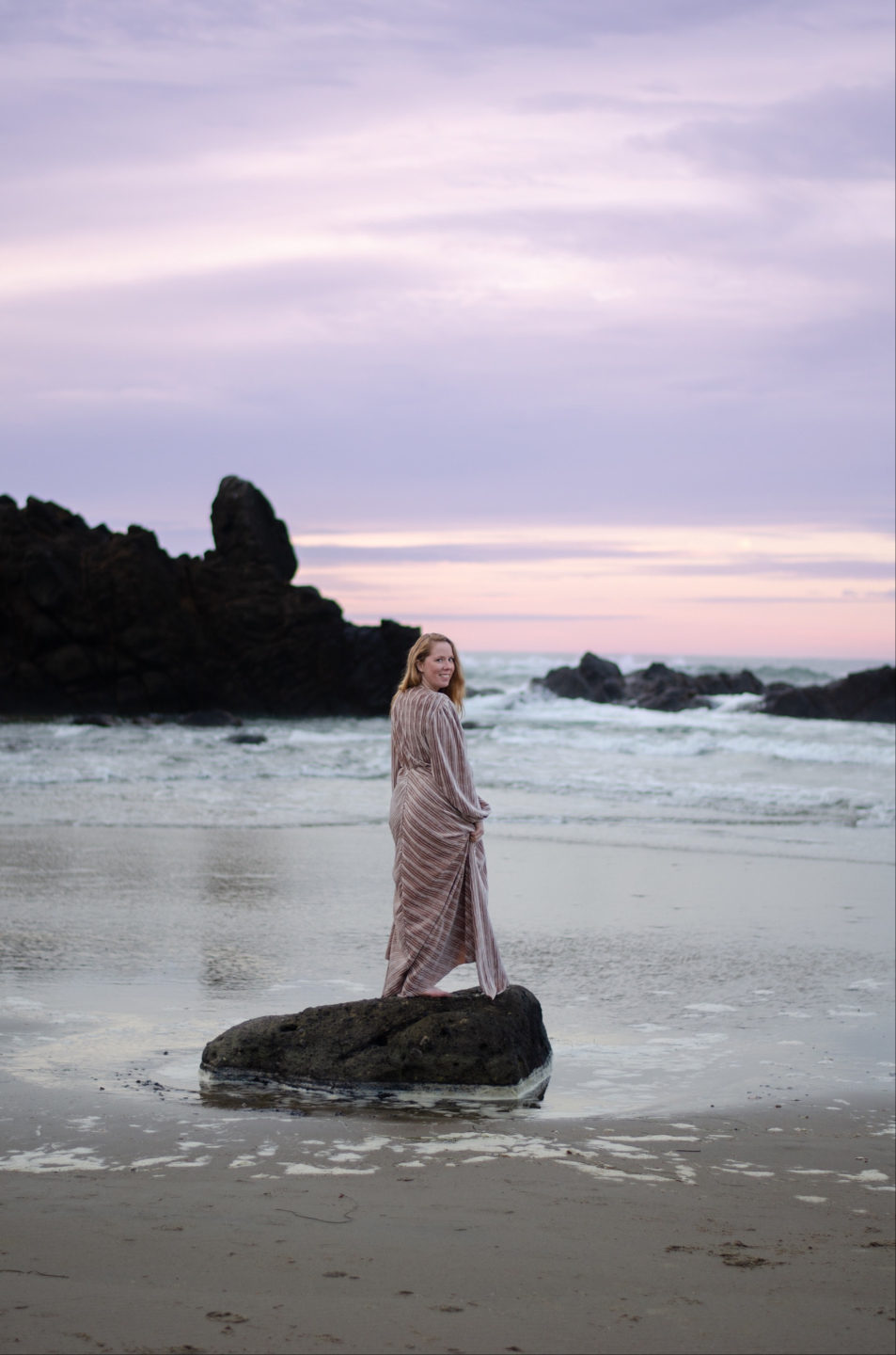 Photo of Kelly Newton with her head looking upwards and eyes closed. 