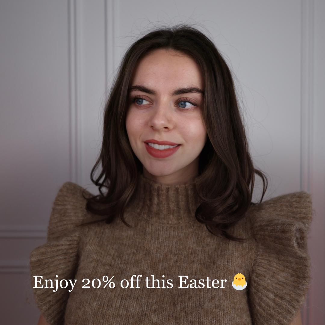 Clémence, French teacher and course founder, smiling in a cozy sweater