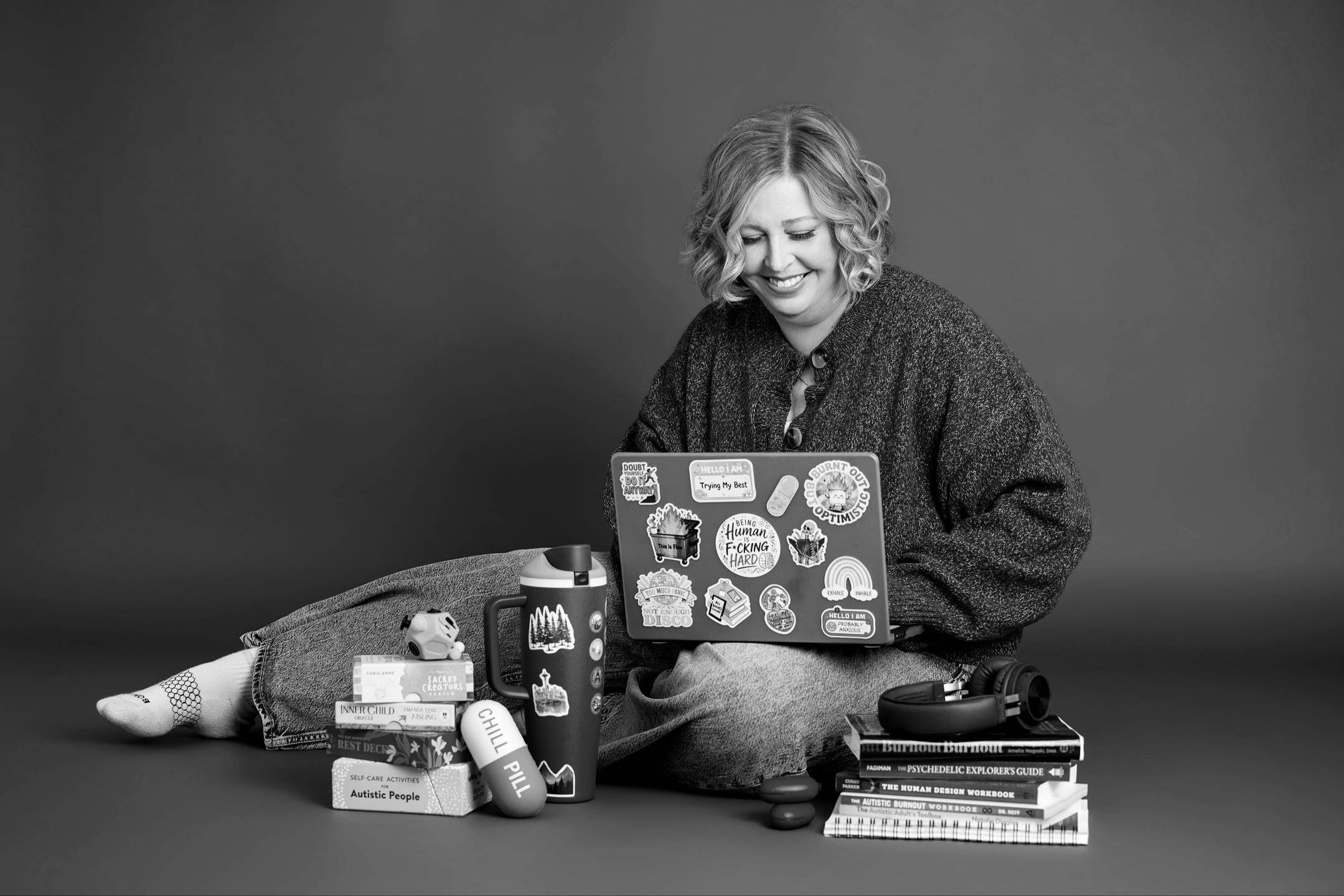 Becca Gerlach with her laptop and books, EMDR intensives, Plymouth, Michigan therapist