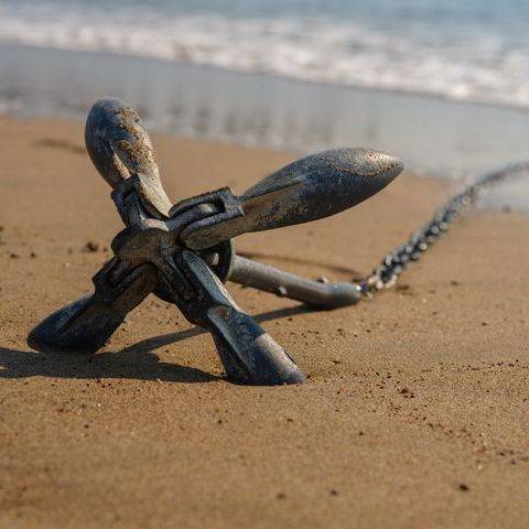 Anchor on the sand of a beach