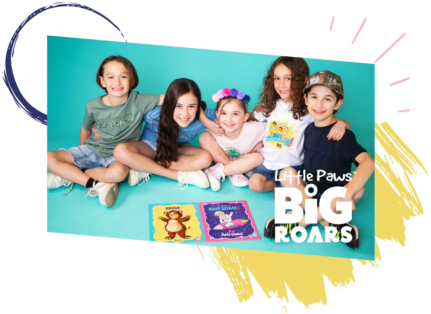 A group of kids facing the camera with a Little Paws Big Roars book