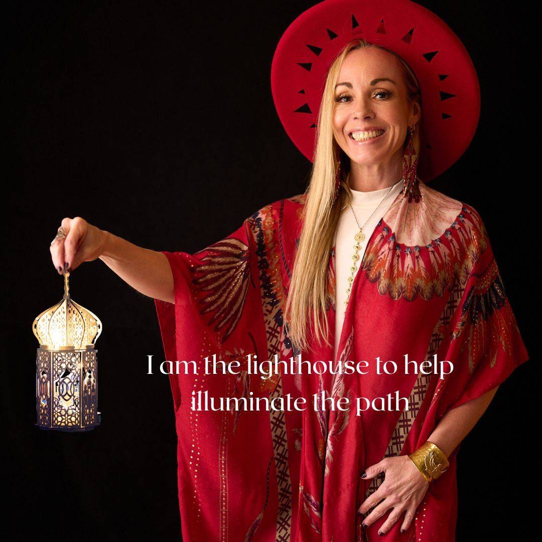 Spiritual life coach Dawn Light Amora holding a lantern, symbolizing inner guidance