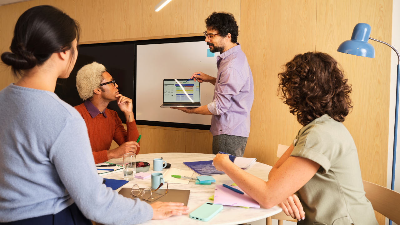 Man presenting to a group of people