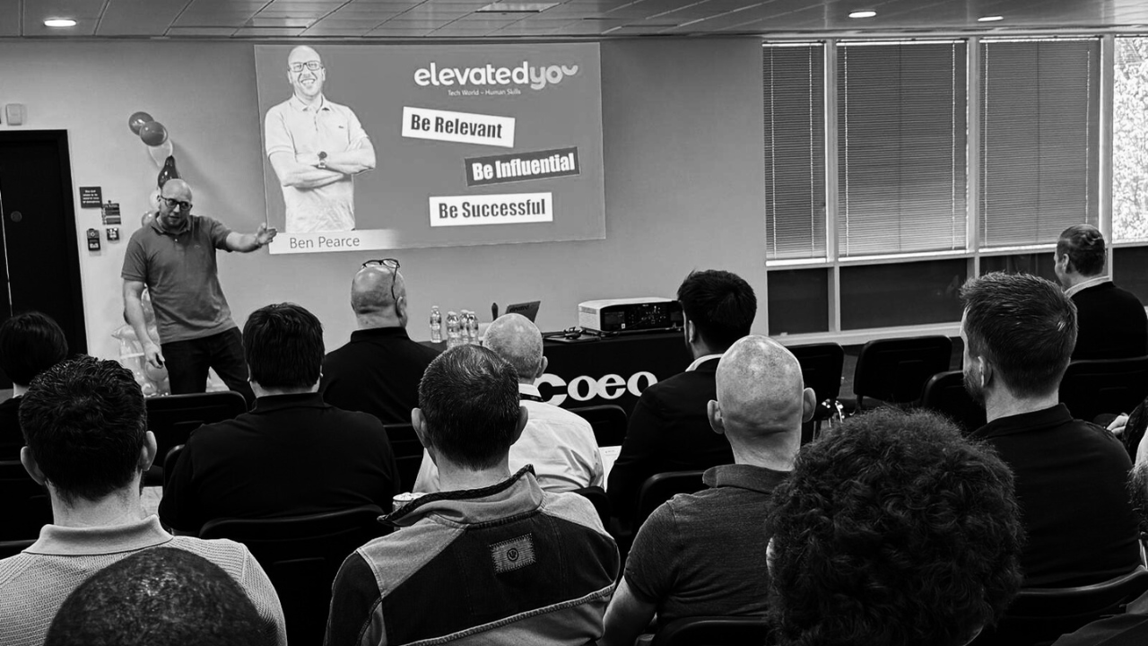 Picture of Ben presenting at customer All Hands event.