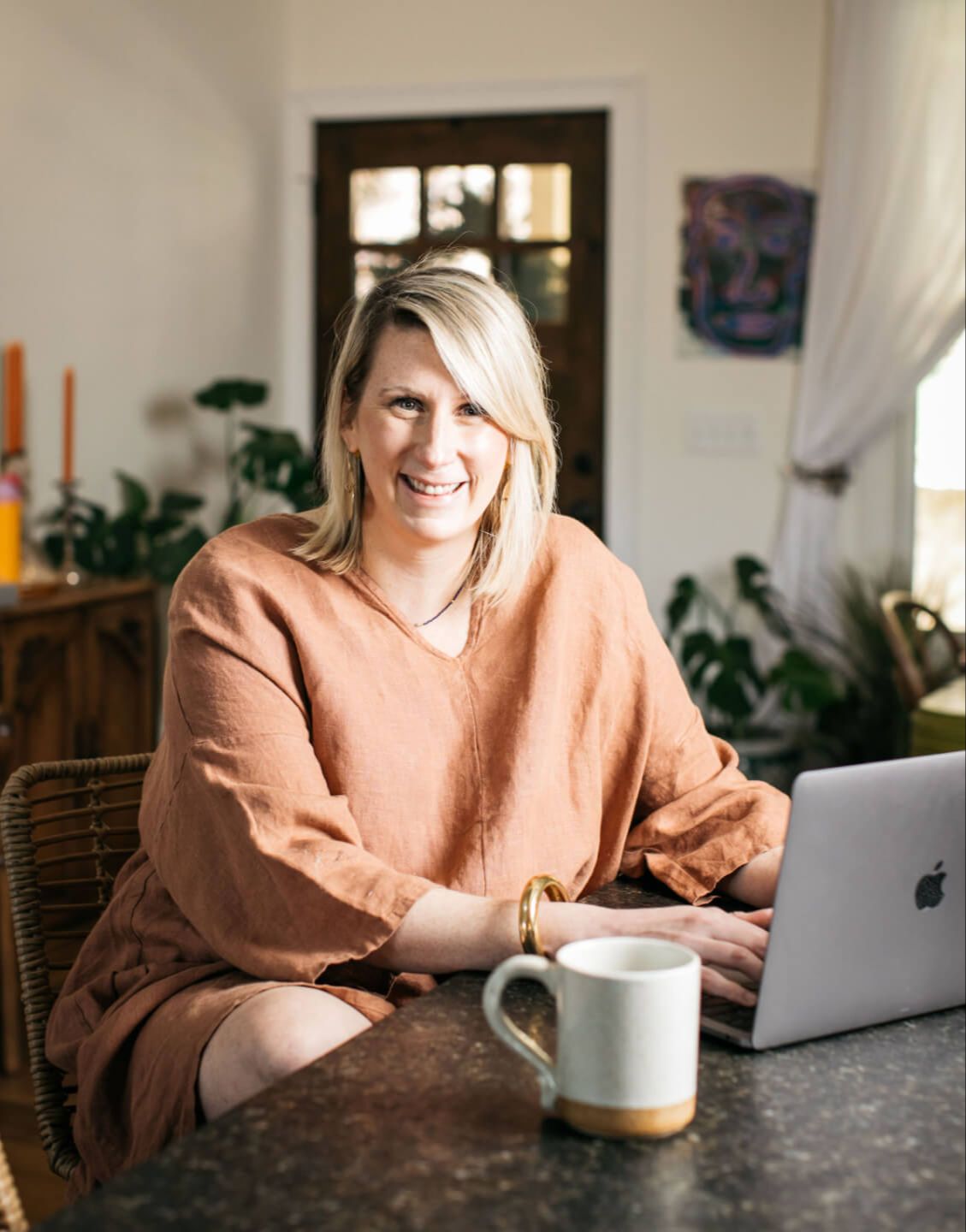 photo of katy poole sitting in a crochet swing