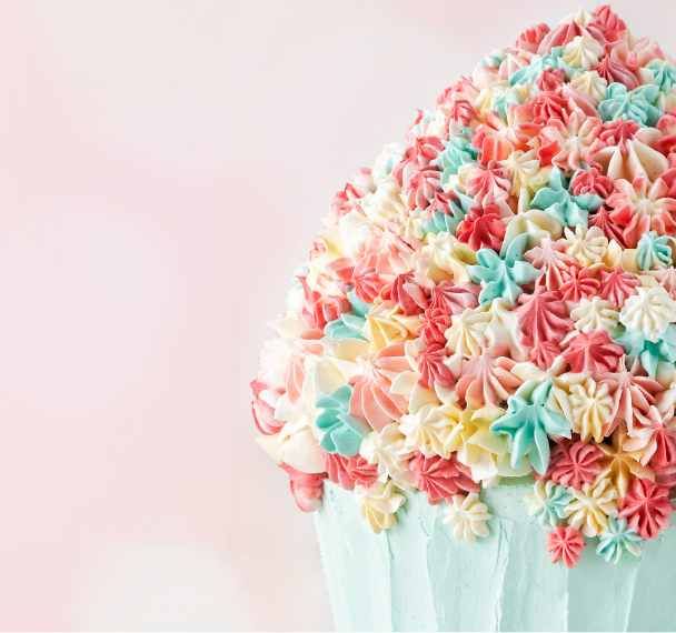 Iced coffee in a glass jar with coffee beans on the side