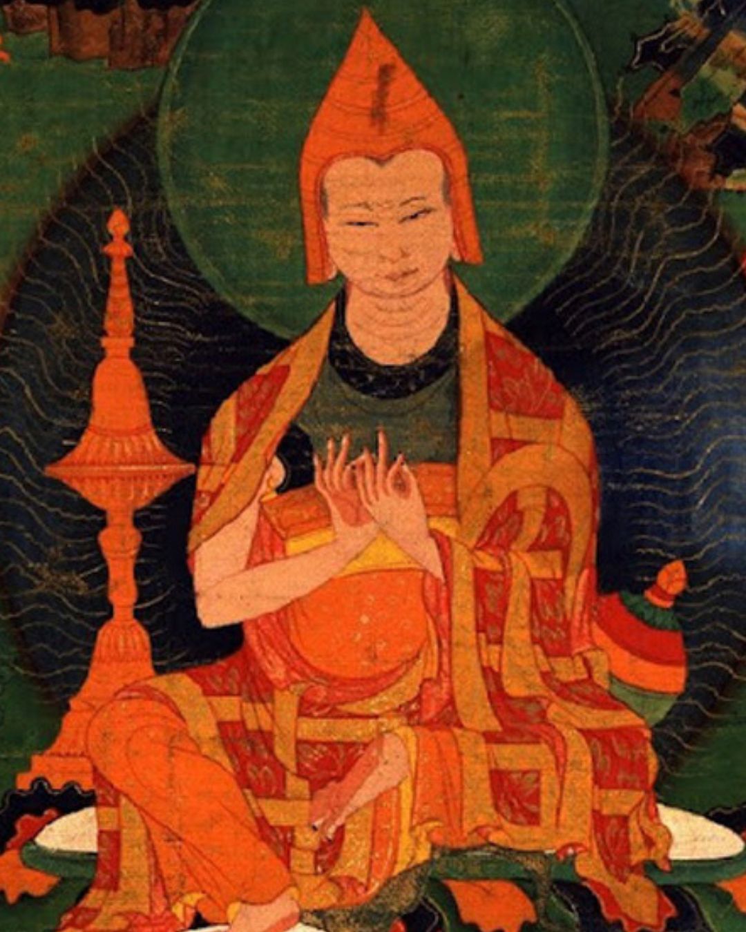Tibetan thangka painting of Atisha Dipamkara (982–1054), the Indian master who brought the Lamrim teachings to Tibet, depicted in traditional orange robes with a teaching hand gesture