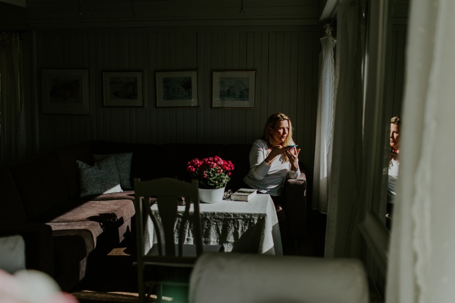 Rita on a phone call by the window