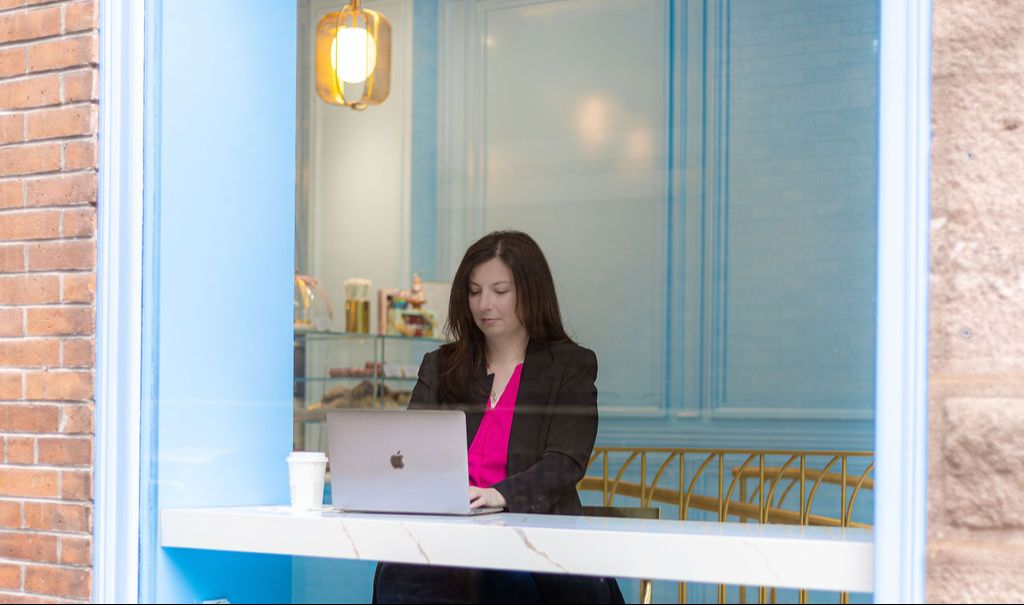 women working lap on marketing help