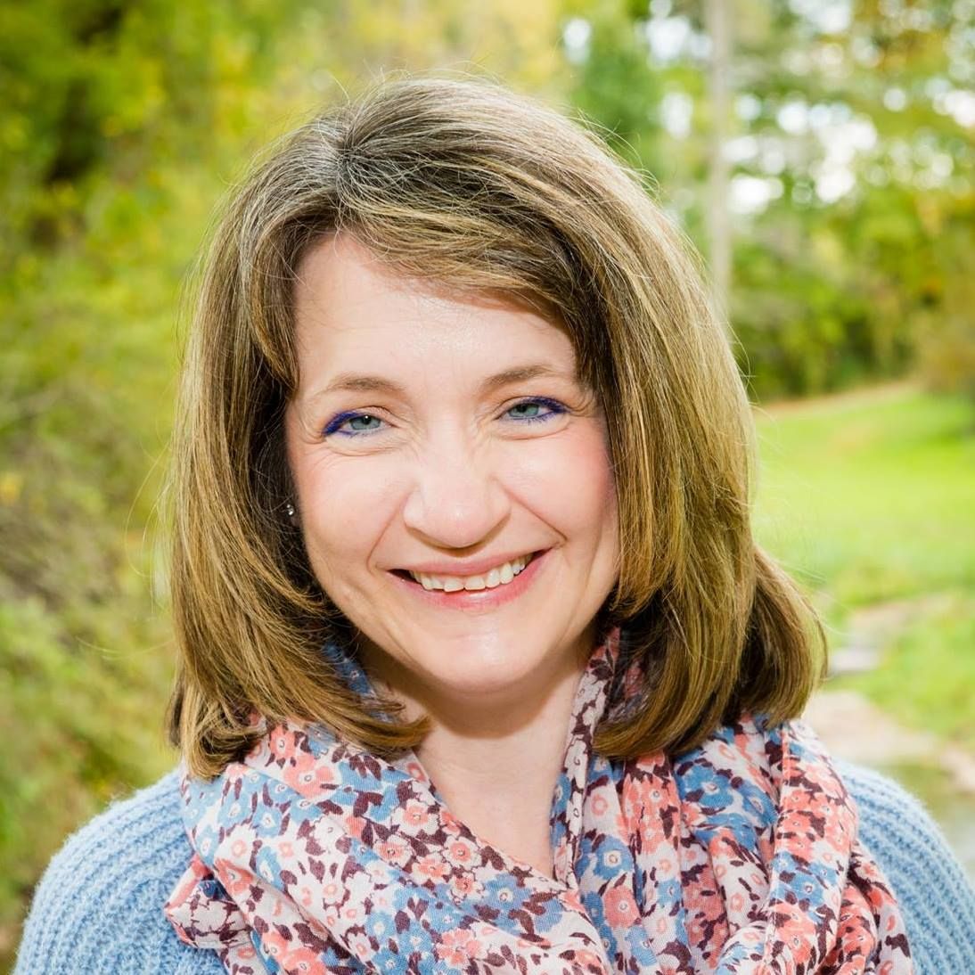 Two women and a man with an artificial leg taking a selfie at a bar