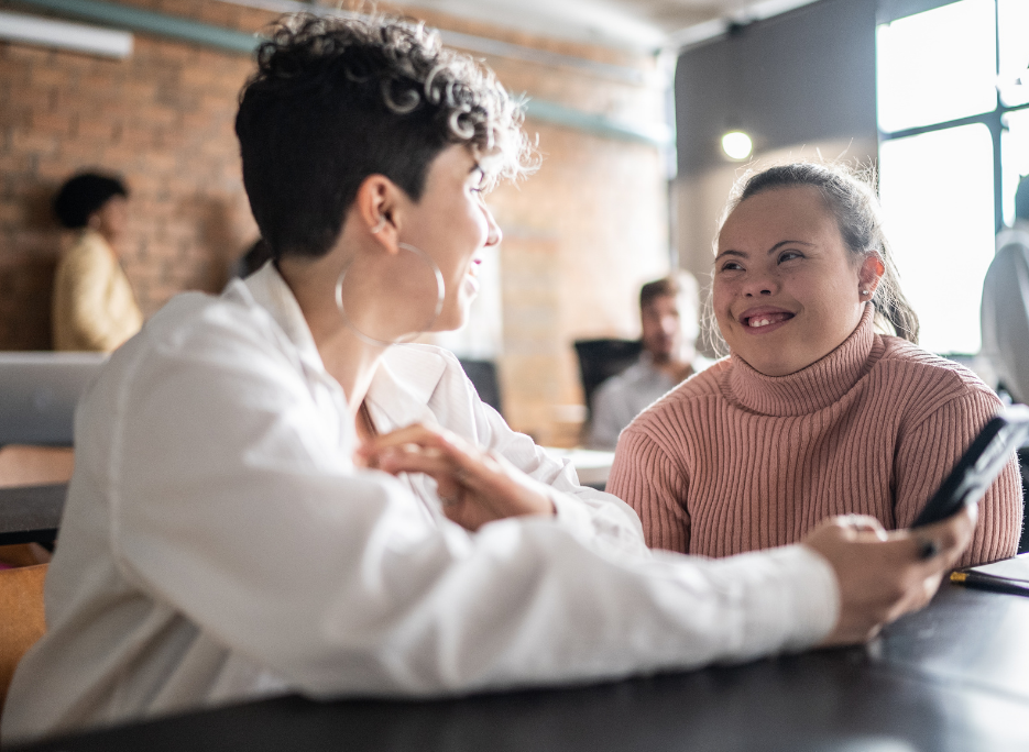 Two women talking at a table