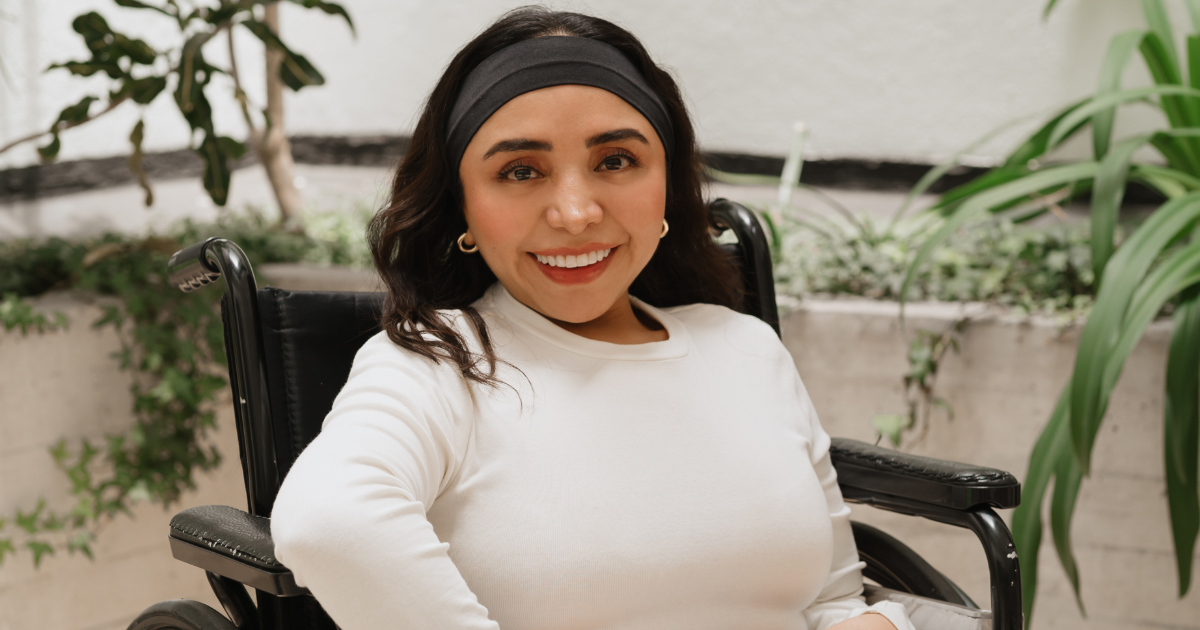 Two women and a man with an artificial leg taking a selfie at a bar