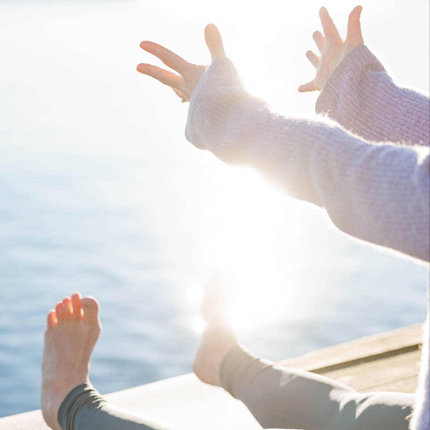 A room full of women sitting by a table, listening to Sofia. 