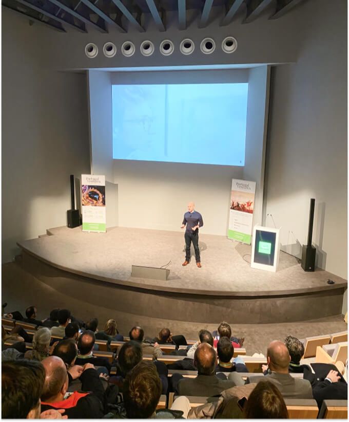 Photo of Dave Bailey, CEO Coach delivering a talk In Portugal, 2019.