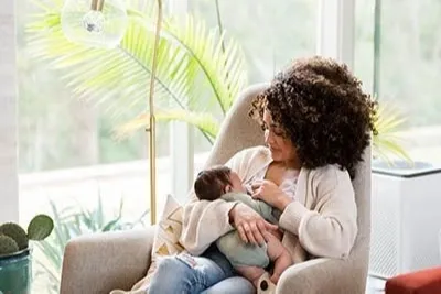 Breastfeeding mother on a couch