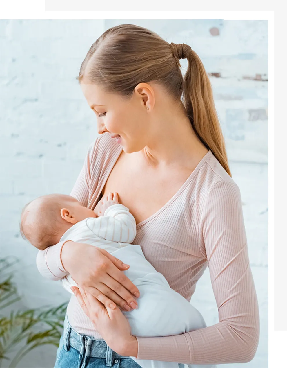 Woman breastfeeding her baby standing up