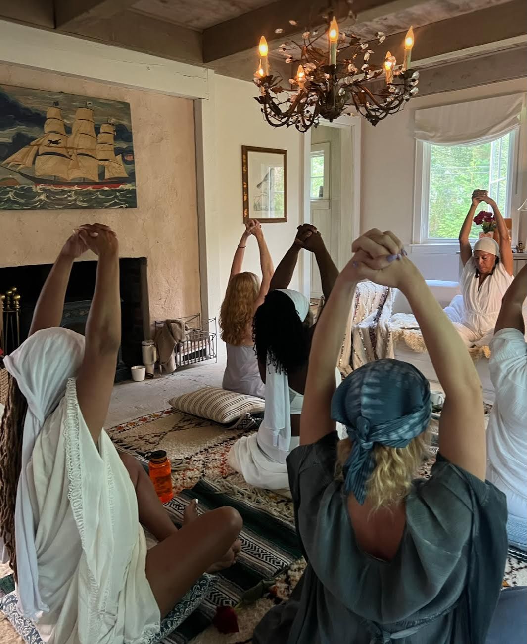 Sisterhood, women dressed in mainly white clothing, dancing and celebrating in Temple143, Brooklyn, New York
