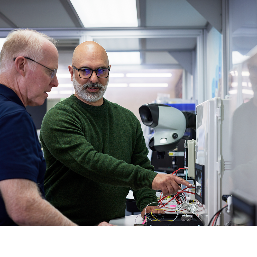 Paul Miklautsch of BOLDR Product Management engaging in conversation with client in a manufacturing setting