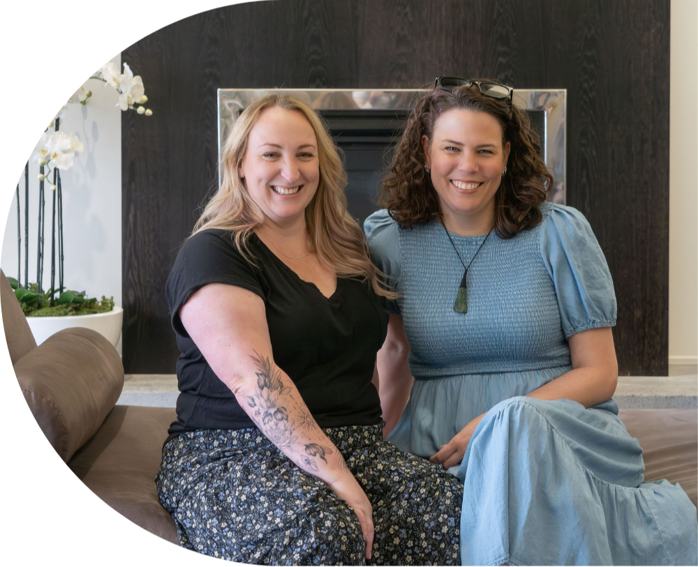 Toyah & Marianne sitting on the couch smiling