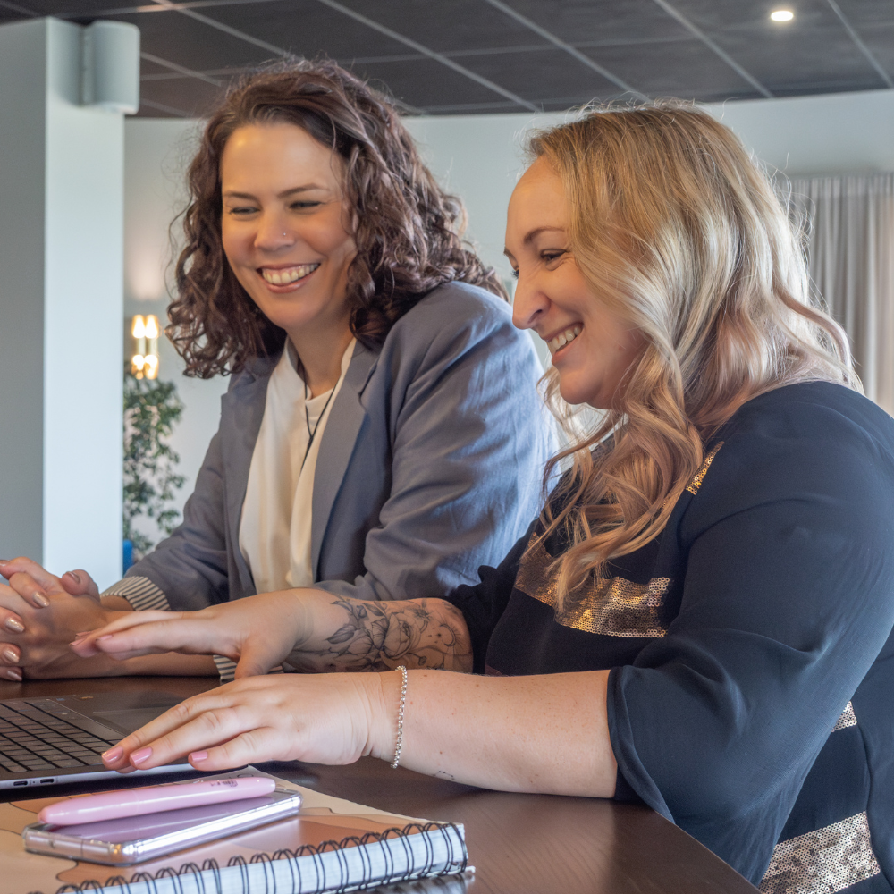 Marianne & Toyah working on a laptop