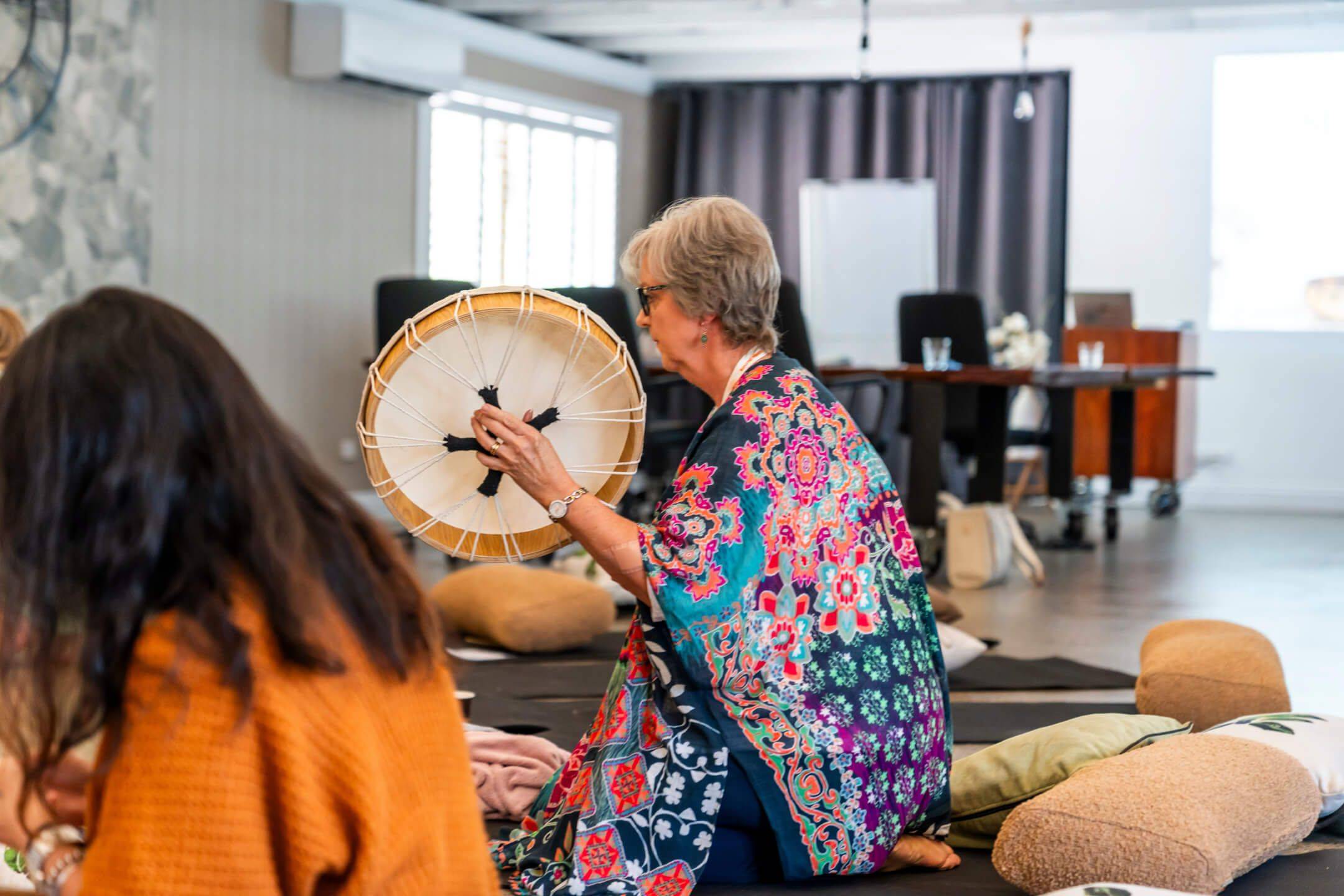 student practitioner practicing how to use the instruments in Holistic Wellness Academy