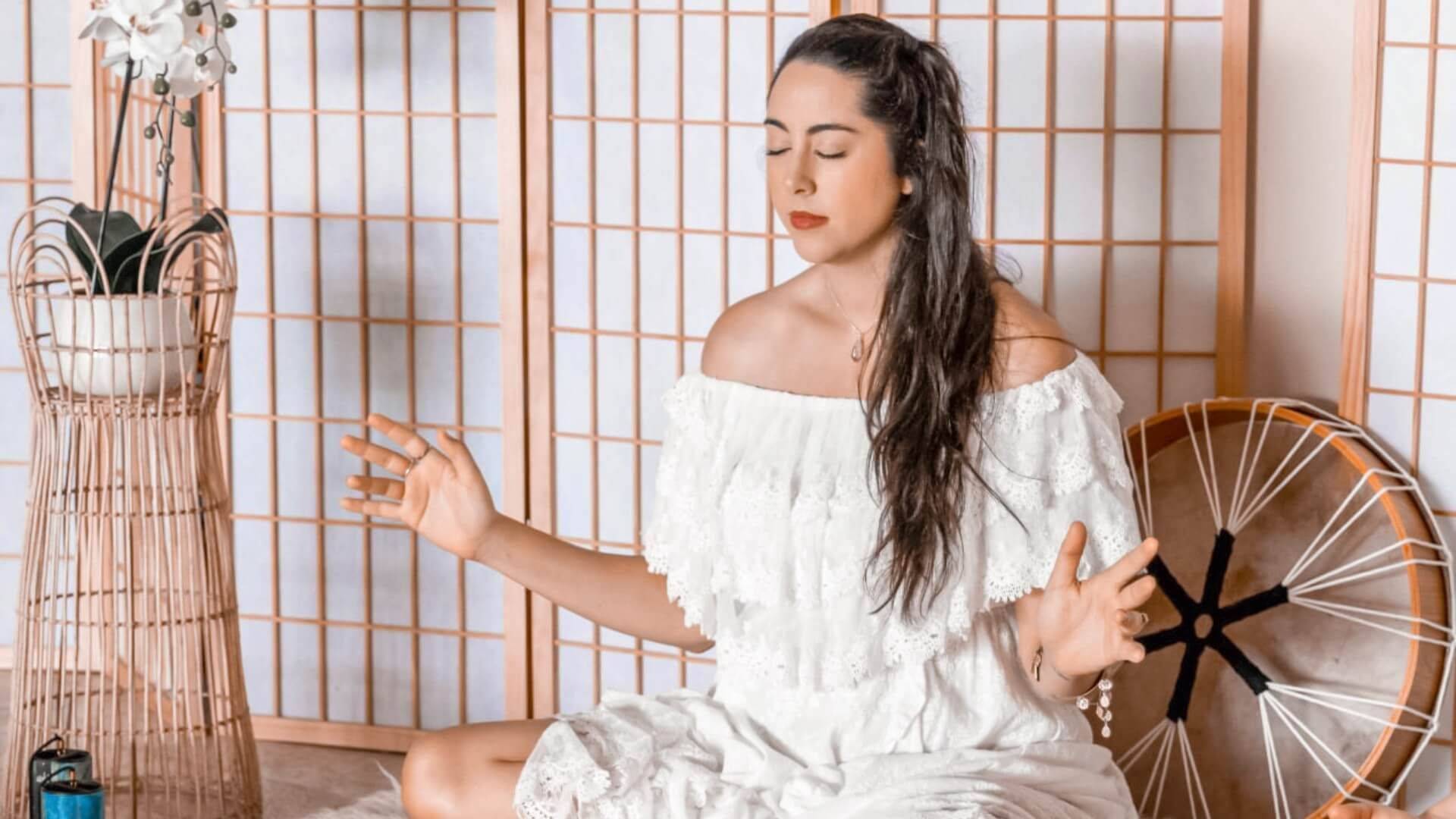 Kirsty Bramwell leading a sound healing meditation with shamanic drum for relaxation and energy healing