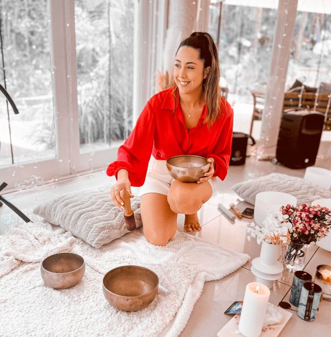 Sound healing practitioner leading a crystal singing bowl sound bath