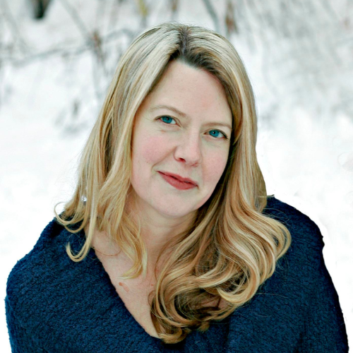 Shannon Post Headshot. A woman with blonde hair in a dark blue sweater against a snowy background.