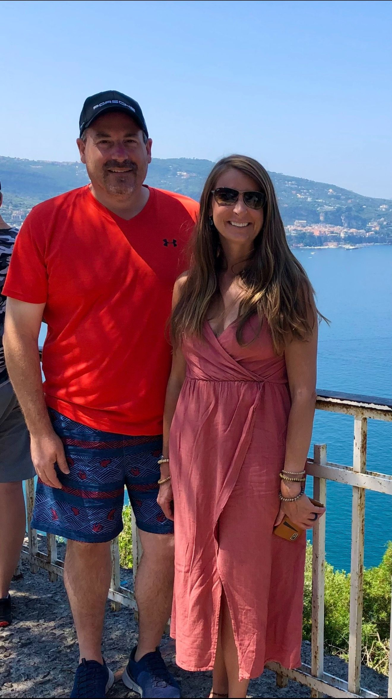 scott and melissa in front of an amelia island sunset