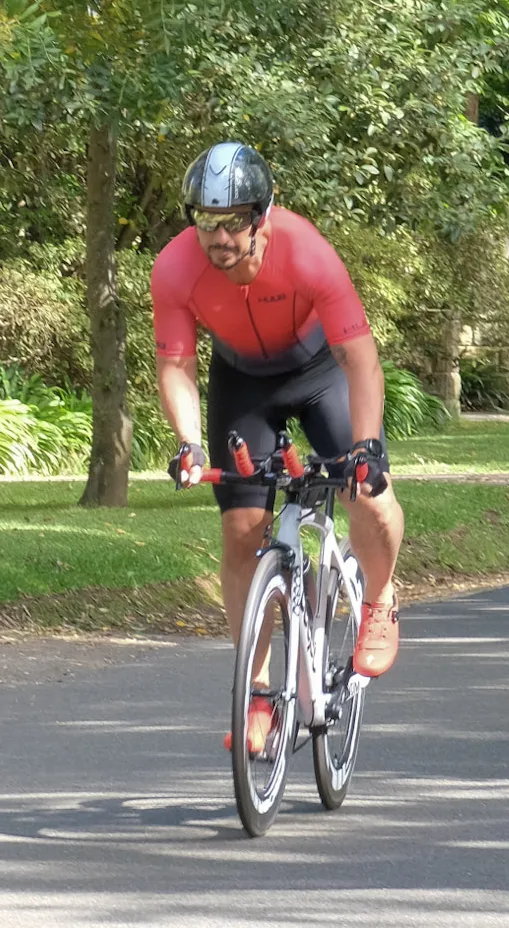 Matt Davies from Astute Fitness cycling in an IRONMAN event