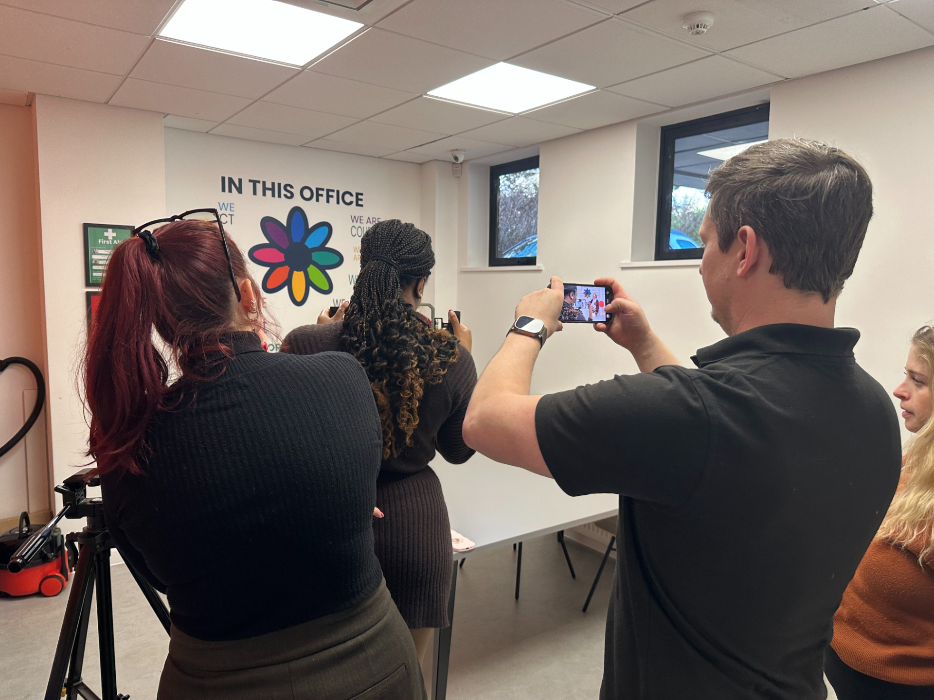 Small group of business professionals attending a face-to-face smartphone video training workshop led by the Business Film School.