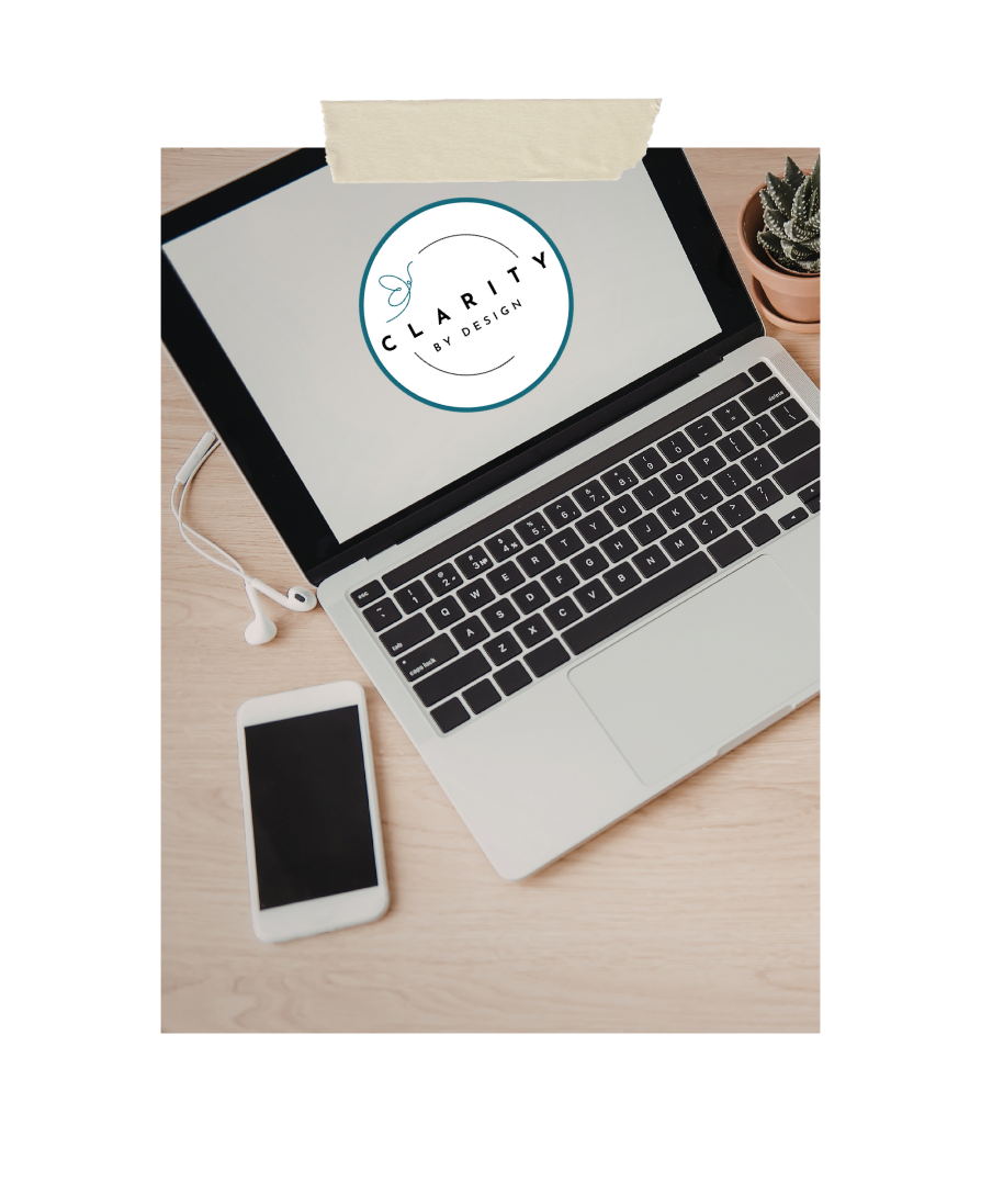 A computer displaying the Clarity by Design, LLC logo on a home desk, representing that Serenely Rooted operates under Clarity by Design, LLC and shares its focus on clarity, organization, and intentional living.