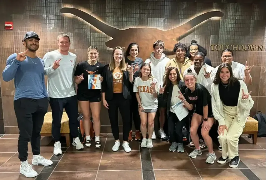 Dr. Ashley Kuchar with athletes from The University of Texas at Austin