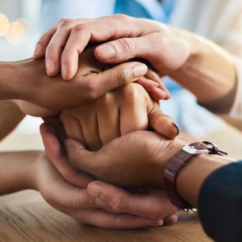 Women's hands piled together