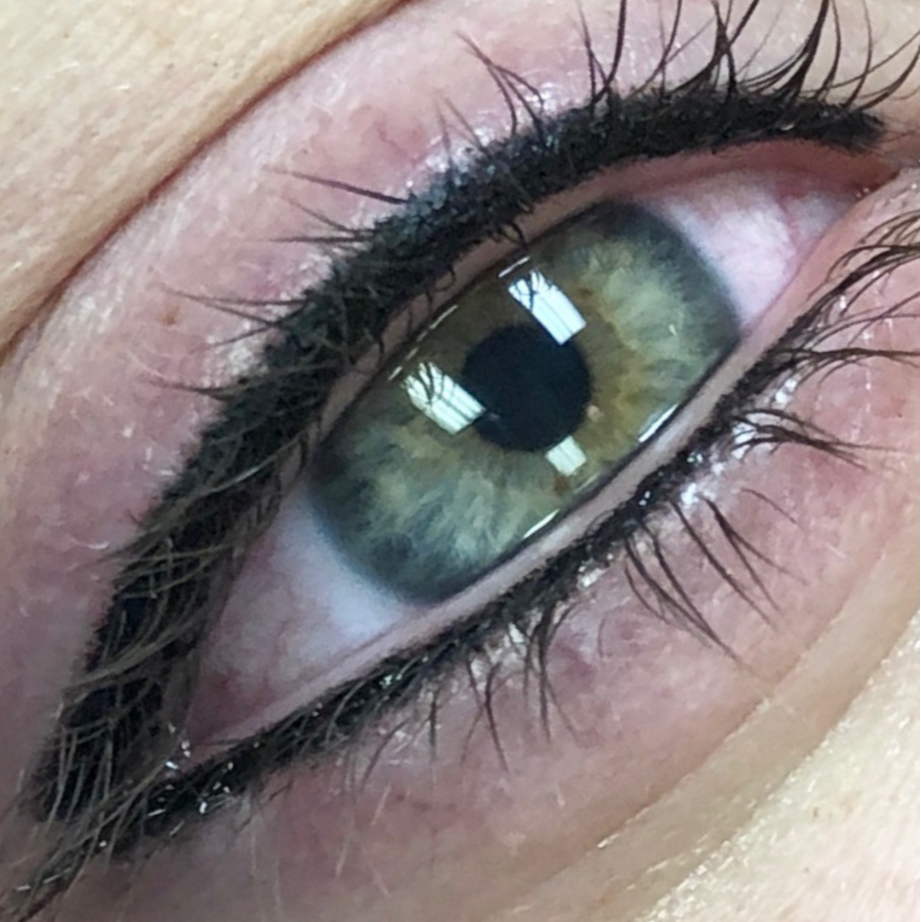 Image is of a tattooed top and bottom eyeliner lash line enhancement.