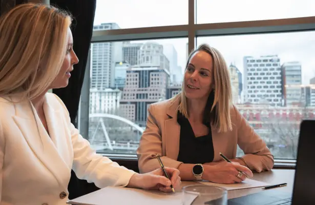 Two team members collaborating on a table