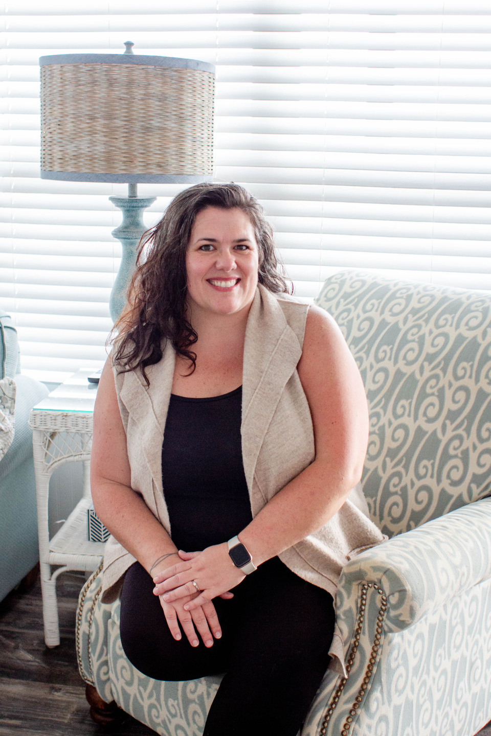 Therapist and site owner Kate smiling with baby