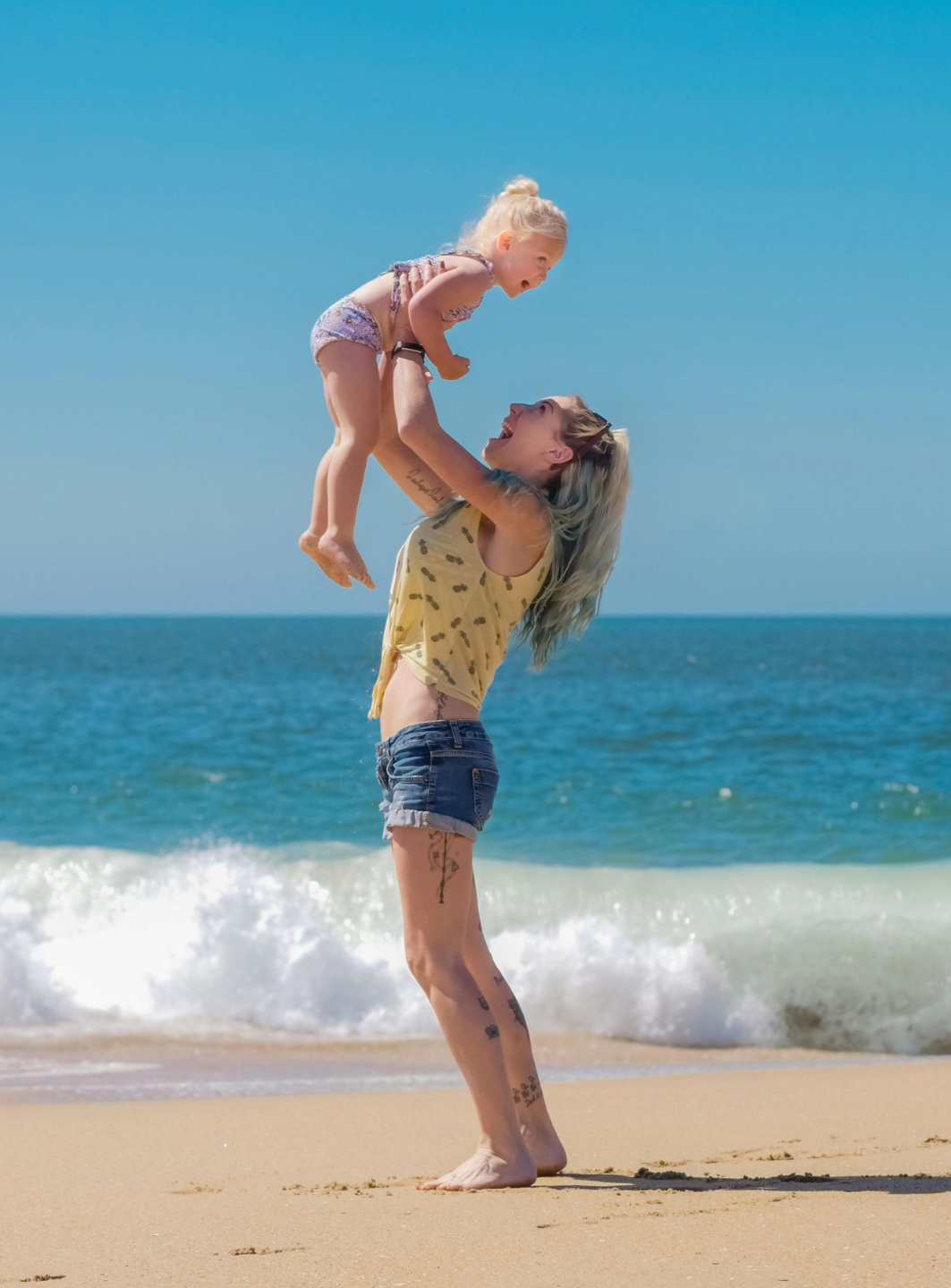 Physical therapist adjusting postpartum mother doing hypopressive breathing