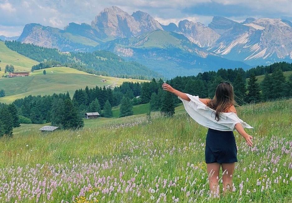 Physical therapist sitting with patient showing her a model of the pelvic floor