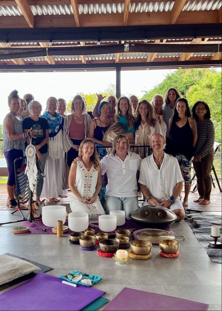 Jason Donaldson, MA, Galactic Shaman, with smiling participants after a Galactic Breathing ceremony on the Big Island of Hawaiâi, radiating peace and connection.
