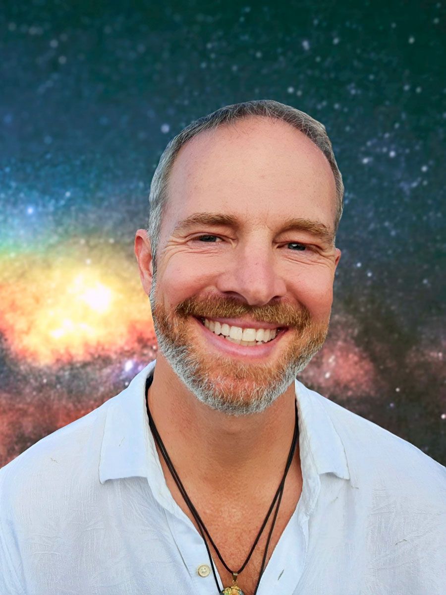 Jason Donaldson, MA, Galactic Shaman, Healer, breath and energy guide, smiling surrounded by cosmic energy.