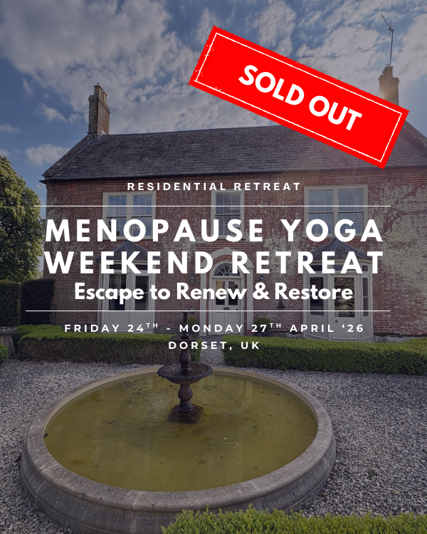 Four middle aged women outdoors all laughing wearing yoga clothes and carrying yoga mates