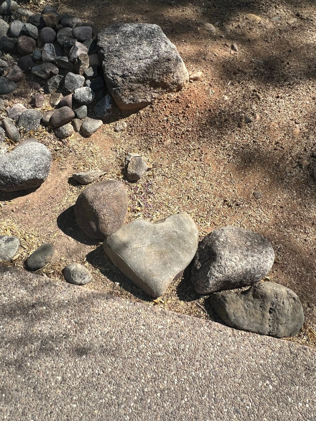 heart-shaped rock on a hiking trail