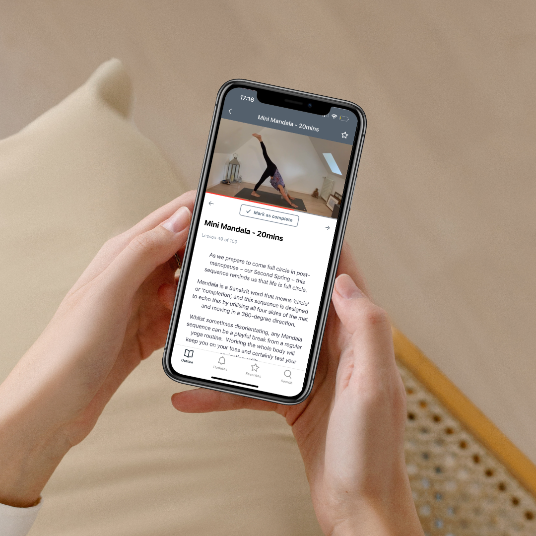 Practice calendar on tablet device alongside phone and laptop showing Julie Ann Garrido teaching yoga for menopause