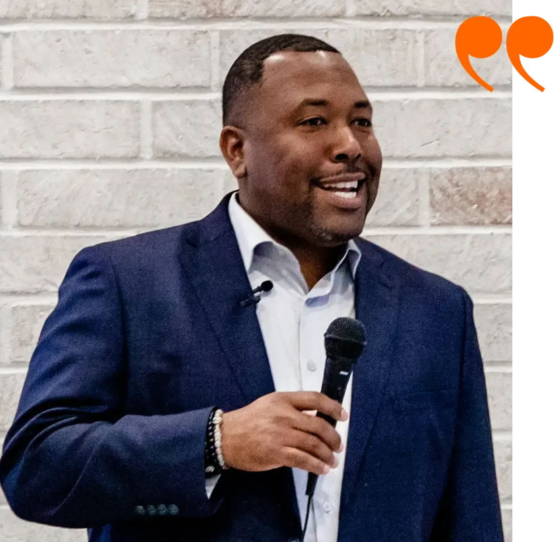 An image of Jamar James, a man speaking into a microphone, with quotation marks graphic suggesting he is giving a testimonial or speech.