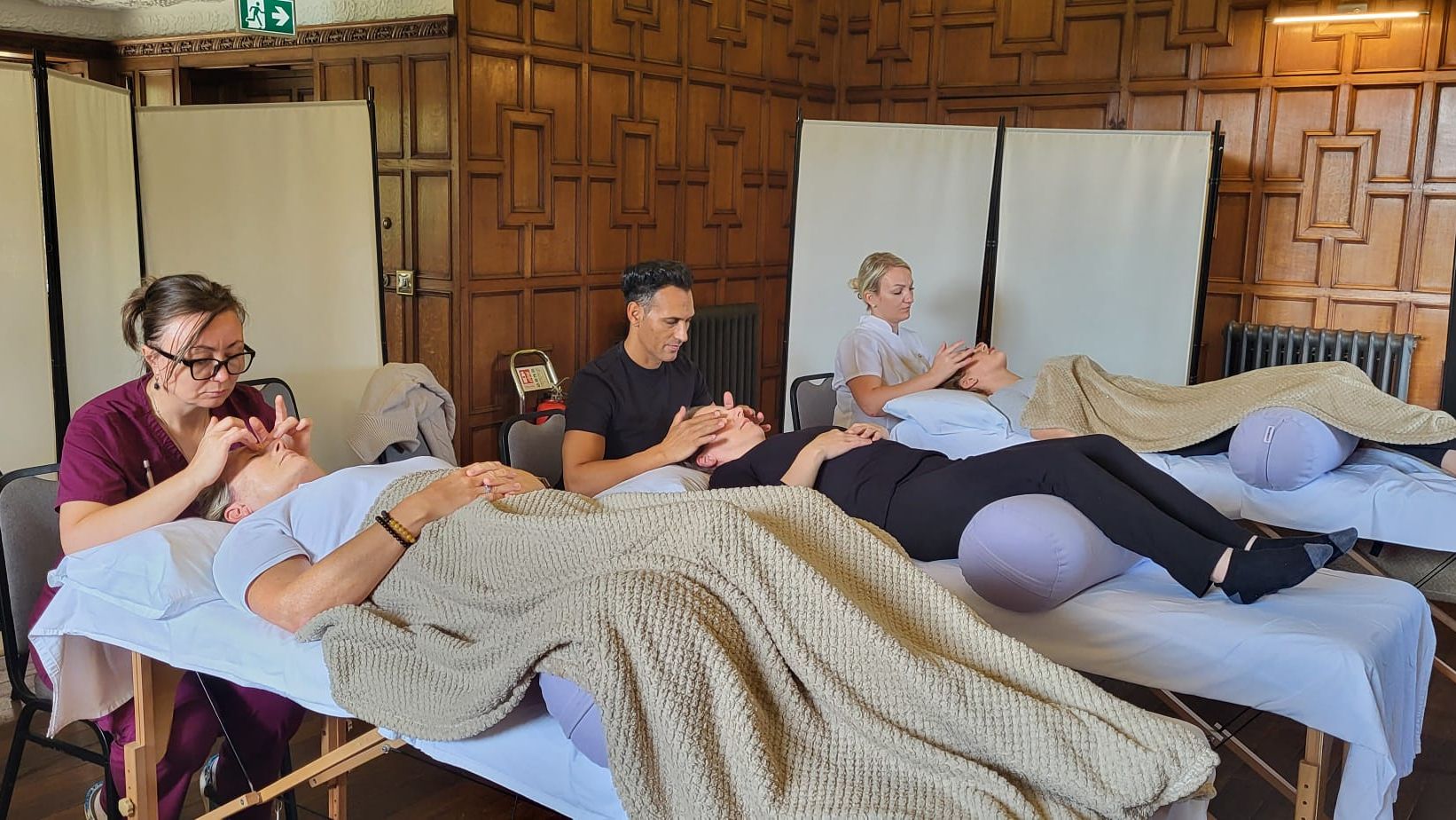 Photo showing students of the Aftercare Academy practising their protocols for after facelift surgery