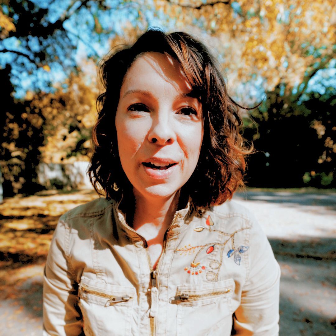 about_heather mays intuitive artist animal communicator medium channeler_woman in front of yellow trees in autumn