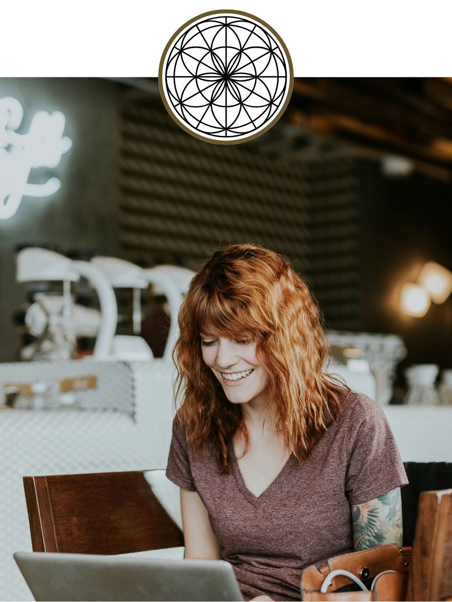 redhead woman at computer for intuitive ascension spiritual journey online class