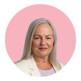 Tania Gorry, Business Coach, pink circle, white jacket, silver hair