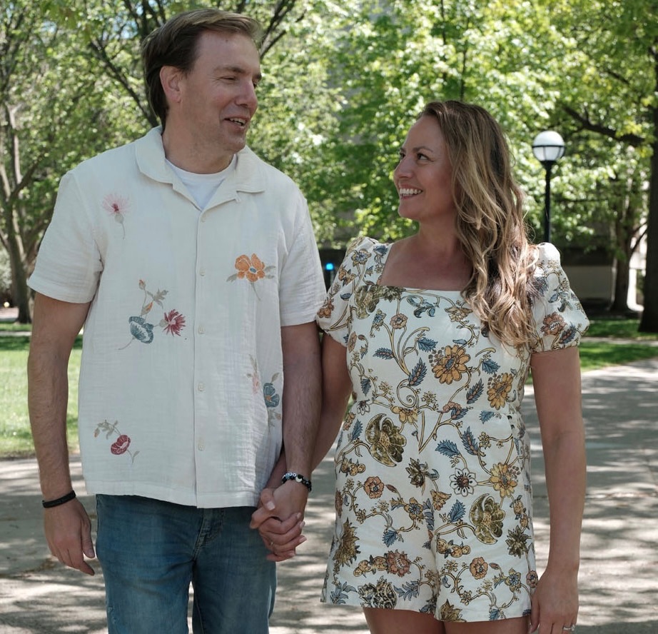 Erin and Chris Verdis, life coaches for parents, teens, and young adults, walking together and smiling.